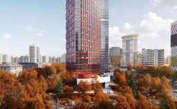 Башня ЖК НЕКСУС от Аквилон на белом стилобате с круглым оранжевым павильоном — вид с улицы